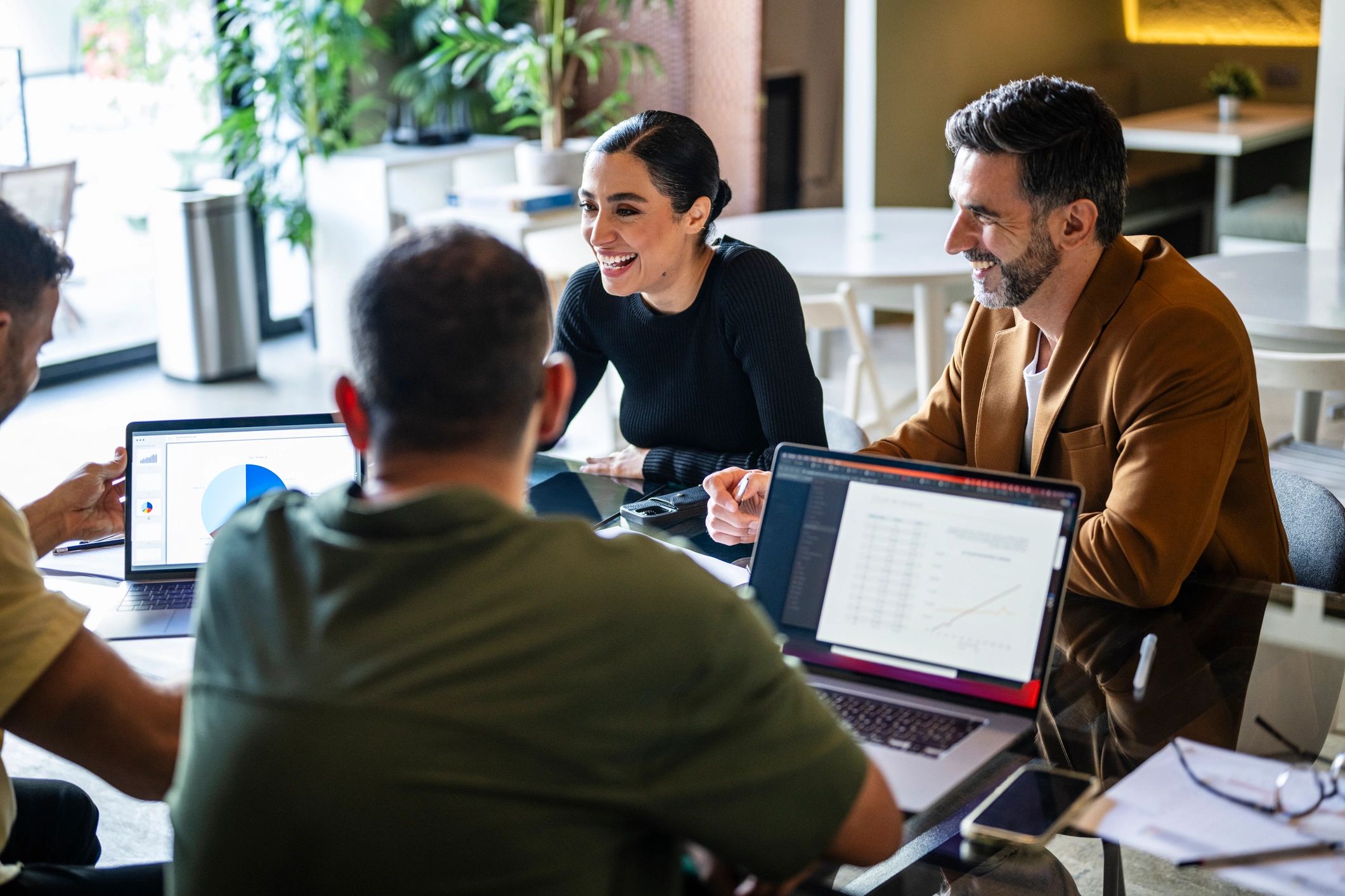 Website Builder Easy team collaborating in a modern meeting space