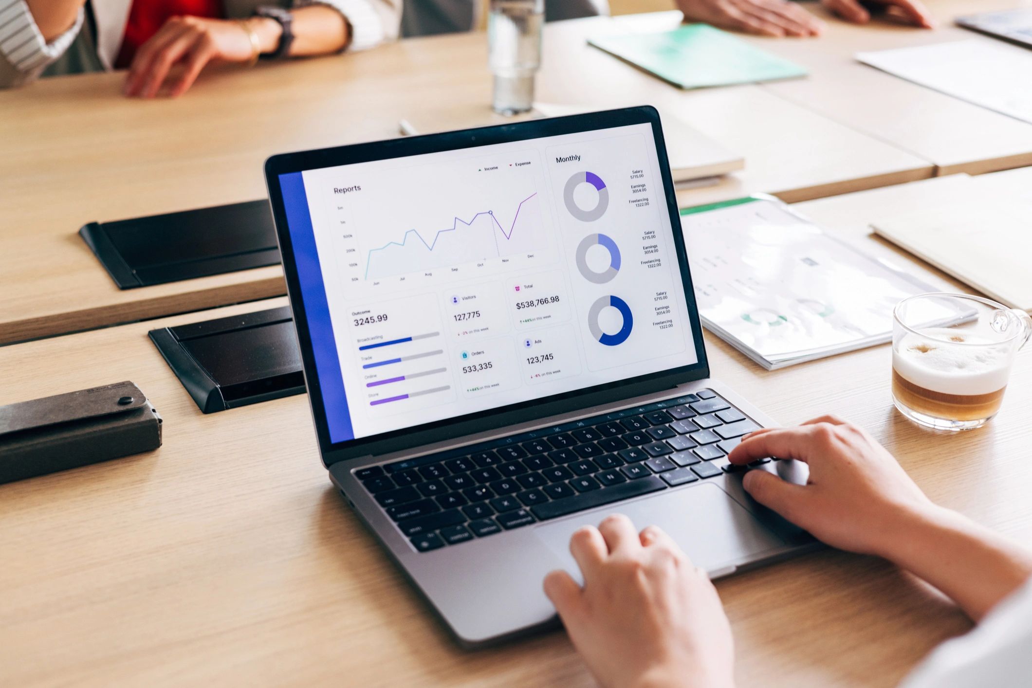 Professional businessperson analyzing website performance and data on a laptop
